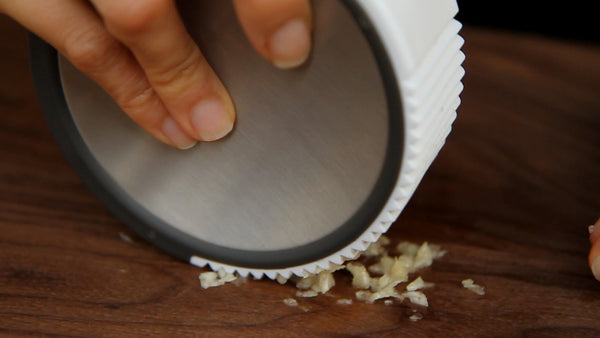 Squish moulded garlic crusher ginger grater
