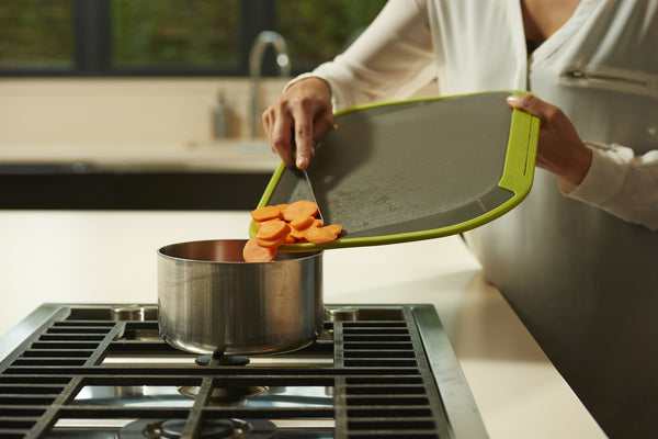 tilt chopping board corners can be used to funnel food.