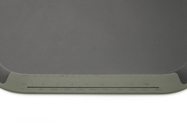 Tilt - angled non-slip chopping board